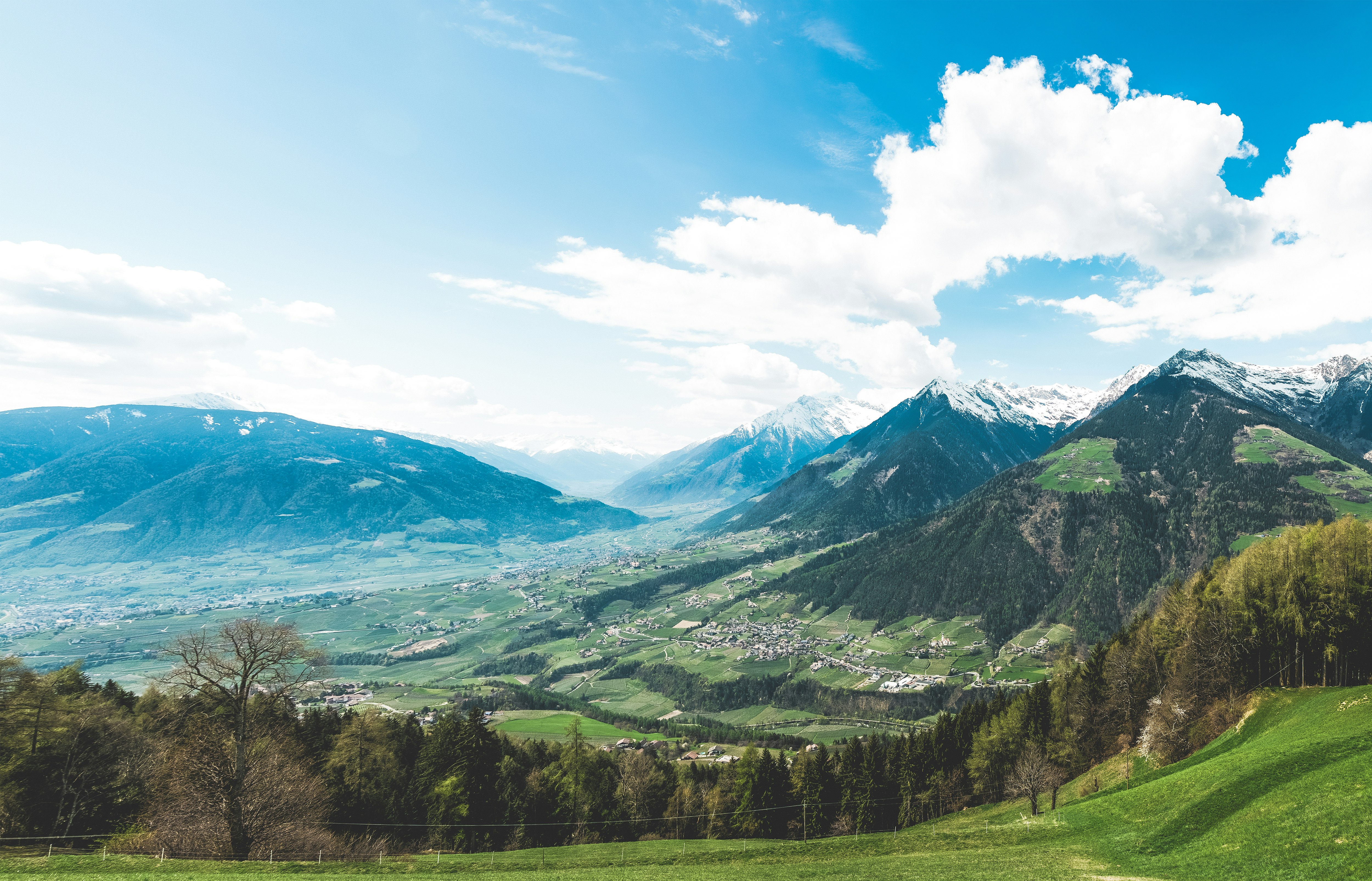 white clouds over rolling countryside